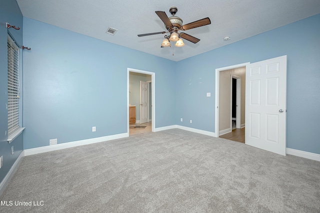 8002 Martin Bluff Rd, Gautier, MS 39553 - unfurnished bedroom featuring carpet flooring, ensuite bath, and ceiling fan