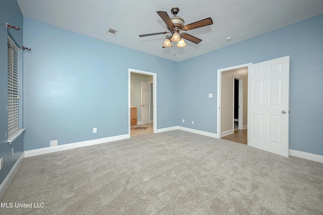 8002 Martin Bluff Rd, Gautier, MS 39553 - unfurnished bedroom featuring carpet floors, connected bathroom, and ceiling fan