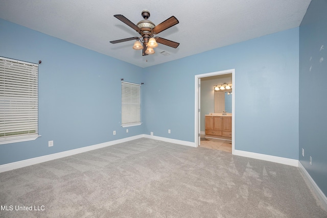 8002 Martin Bluff Rd, Gautier, MS 39553 - unfurnished bedroom featuring carpet, ensuite bathroom, and a ceiling fan