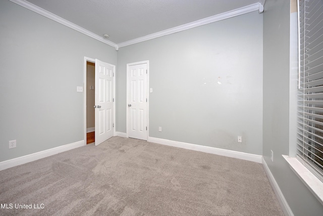 8002 Martin Bluff Rd, Gautier, MS 39553 - spare room featuring crown molding, carpet flooring, and a smoke detector