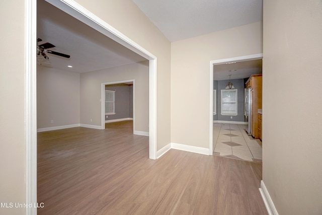 8002 Martin Bluff Rd, Gautier, MS 39553 - spare room with light wood-style flooring and a ceiling fan
