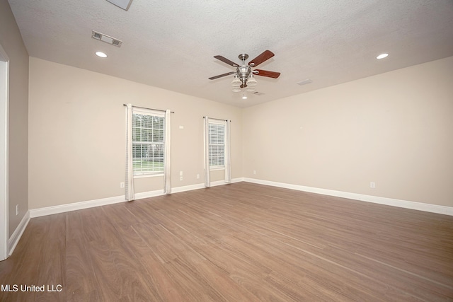8002 Martin Bluff Rd, Gautier, MS 39553 - spare room featuring a ceiling fan, wood finished floors, a textured ceiling, and recessed lighting