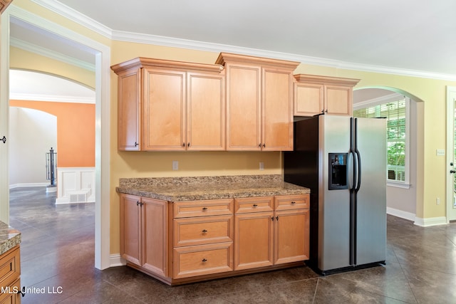 7672 N Rigmoore Pt, Olive Branch, MS 38654 - kitchen with arched walkways, stainless steel refrigerator with ice dispenser, ornamental molding, and dark tile patterned flooring