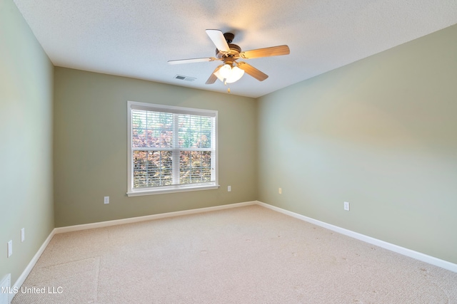7672 N Rigmoore Pt, Olive Branch, MS 38654 - unfurnished room featuring light carpet, ceiling fan, baseboards, and a textured ceiling