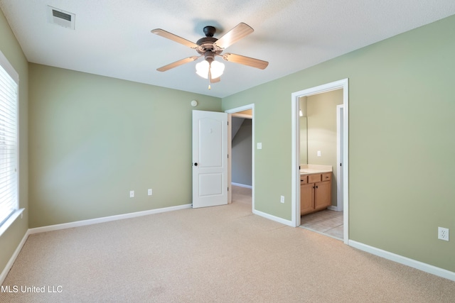 7672 N Rigmoore Pt, Olive Branch, MS 38654 - unfurnished bedroom featuring light carpet, multiple windows, and baseboards
