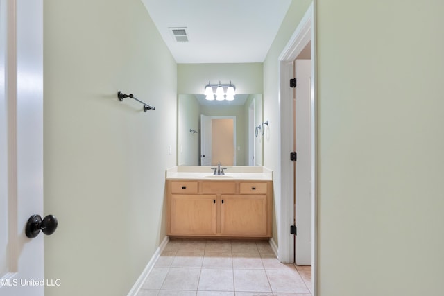 7672 N Rigmoore Pt, Olive Branch, MS 38654 - bathroom with vanity, tile patterned flooring, baseboards, and a chandelier