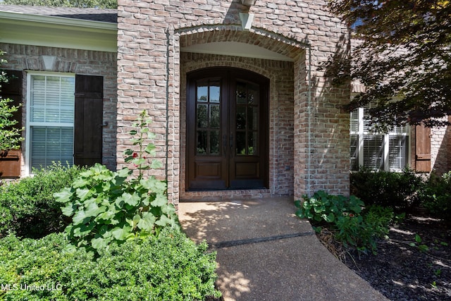 7672 N Rigmoore Pt, Olive Branch, MS 38654 - view of exterior entry featuring brick siding and french doors