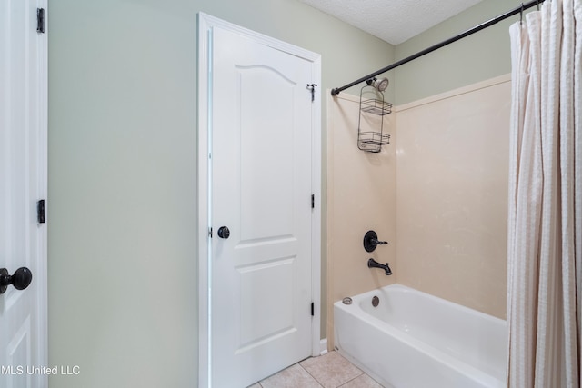 7672 N Rigmoore Pt, Olive Branch, MS 38654 - full bath featuring shower / bath combo, tile patterned flooring, and a textured ceiling