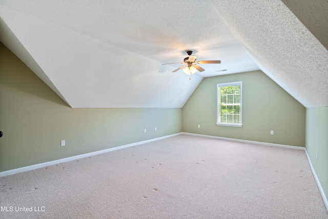 7672 N Rigmoore Pt, Olive Branch, MS 38654 - bonus room with ceiling fan, lofted ceiling, carpet flooring, baseboards, and a textured ceiling