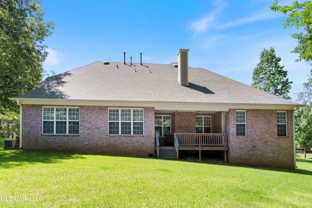 7672 N Rigmoore Pt, Olive Branch, MS 38654 - back of property with a chimney, a wooden deck, brick siding, and a yard