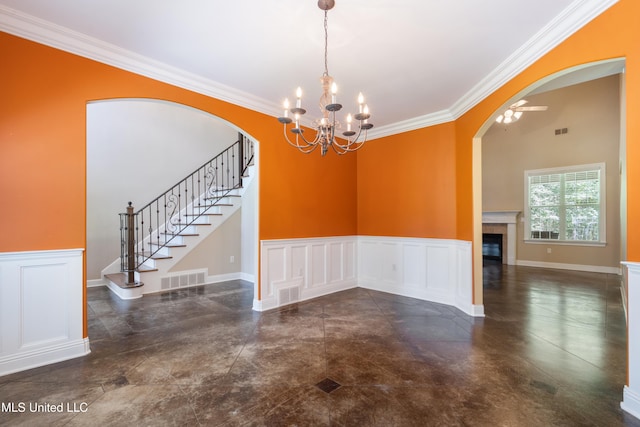 7672 N Rigmoore Pt, Olive Branch, MS 38654 - unfurnished dining area with arched walkways, a wainscoted wall, crown molding, a chandelier, and stairway
