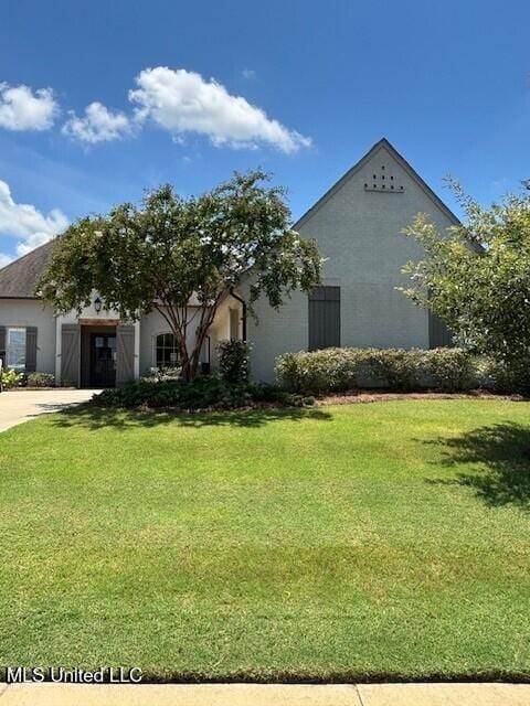 131 Camden Trl, Madison, MS 39110 - view of property exterior featuring a lawn and stucco siding