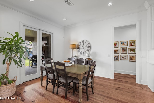 131 Camden Trl, Madison, MS 39110 - dining area featuring french doors, ornamental molding, wood finished floors, and recessed lighting