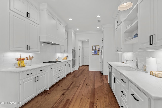 131 Camden Trl, Madison, MS 39110 - kitchen with stainless steel appliances, open shelves, white cabinets, tasteful backsplash, and dark wood-type flooring