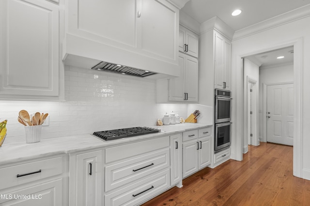 131 Camden Trl, Madison, MS 39110 - kitchen with stainless steel appliances, white cabinets, recessed lighting, backsplash, and light wood finished floors
