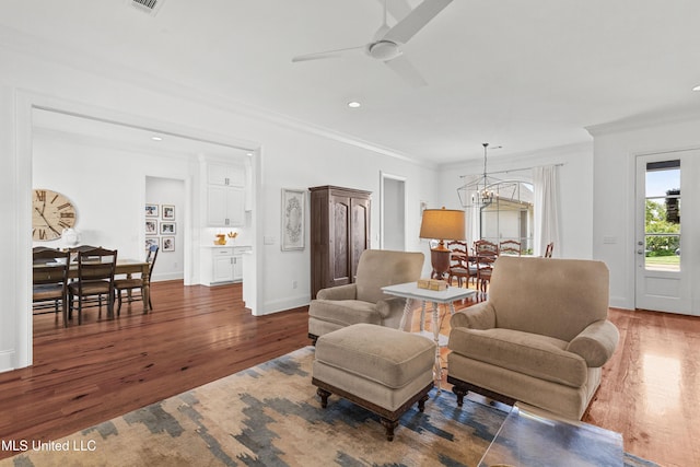 131 Camden Trl, Madison, MS 39110 - living area with wood finished floors, ornamental molding, ceiling fan, a chandelier, and recessed lighting