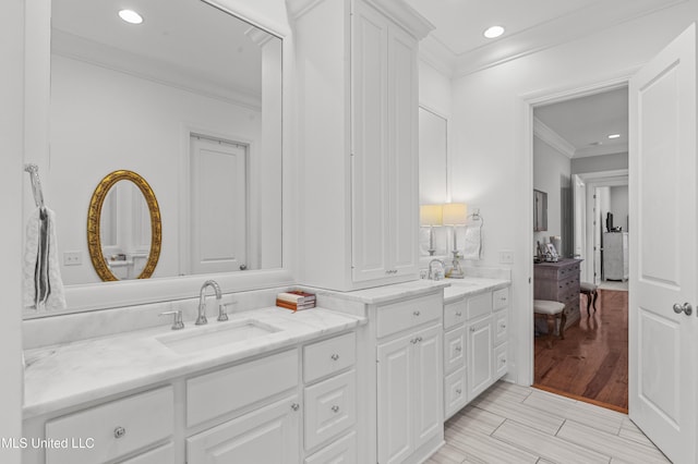 131 Camden Trl, Madison, MS 39110 - full bath featuring crown molding, double vanity, recessed lighting, and wood finished floors