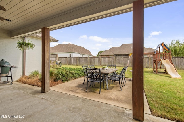 131 Camden Trl, Madison, MS 39110 - fenced backyard featuring a patio, outdoor dining area, and a playground