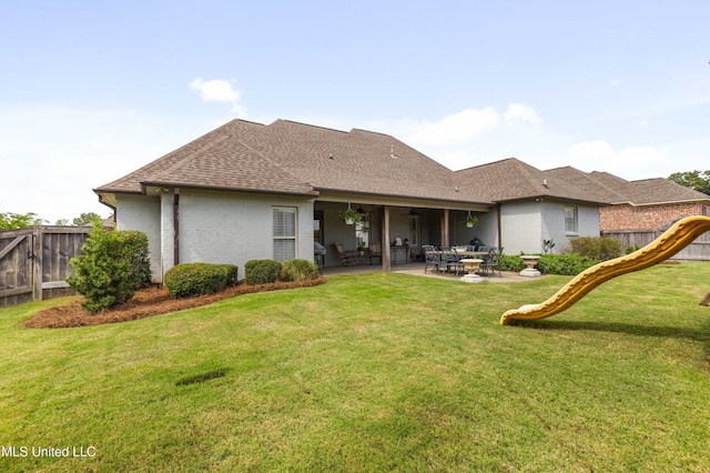 131 Camden Trl, Madison, MS 39110 - rear view of house featuring a playground, a patio area, a shingled roof, and brick siding