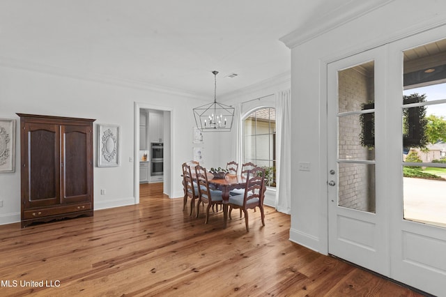 131 Camden Trl, Madison, MS 39110 - dining area featuring a chandelier, crown molding, and light wood finished floors