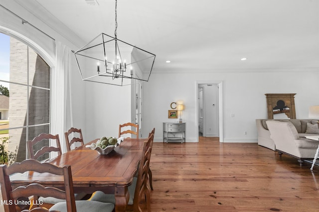 131 Camden Trl, Madison, MS 39110 - dining space featuring crown molding, wood finished floors, a chandelier, and recessed lighting