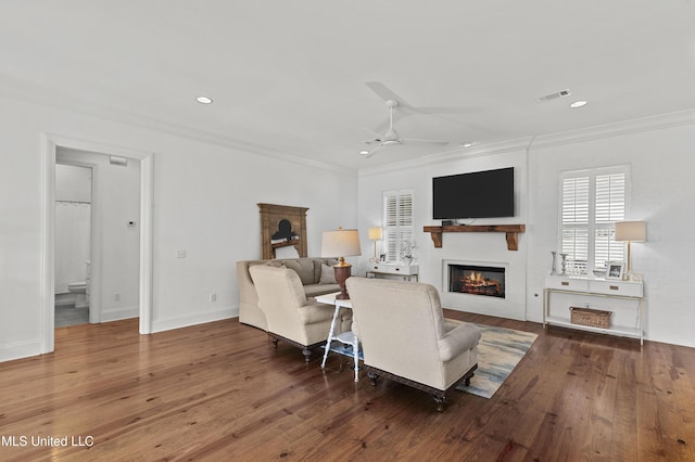 131 Camden Trl, Madison, MS 39110 - living room featuring a large fireplace, ceiling fan, ornamental molding, wood finished floors, and recessed lighting