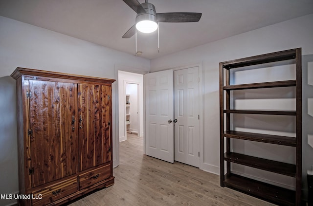 unfurnished bedroom with light hardwood / wood-style flooring and ceiling fan