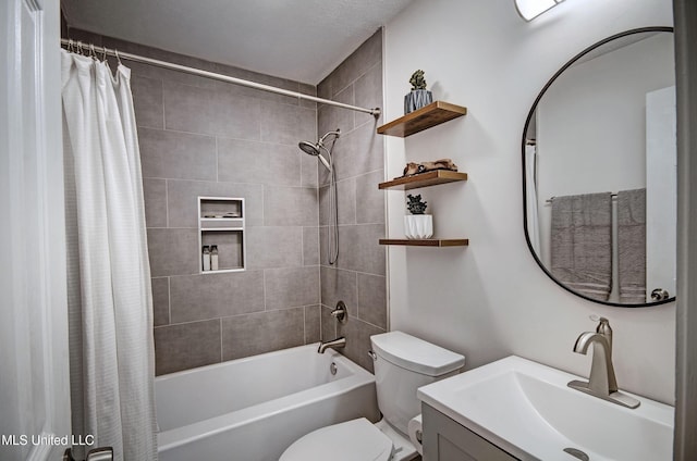 full bathroom featuring vanity, toilet, and shower / bathtub combination with curtain