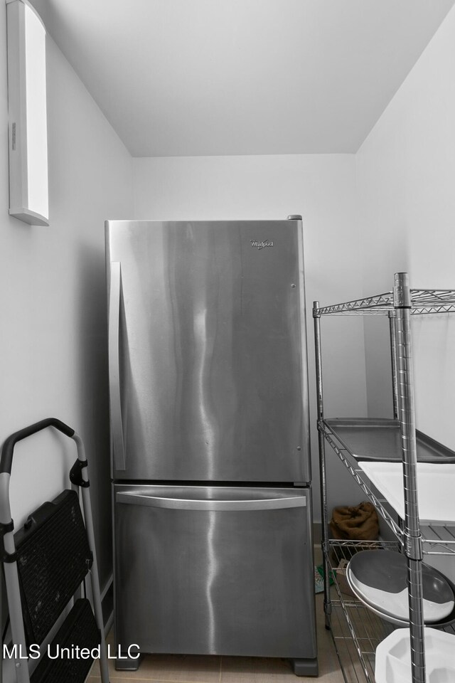 interior details featuring stainless steel fridge