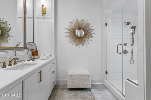 bathroom featuring vanity and an enclosed shower