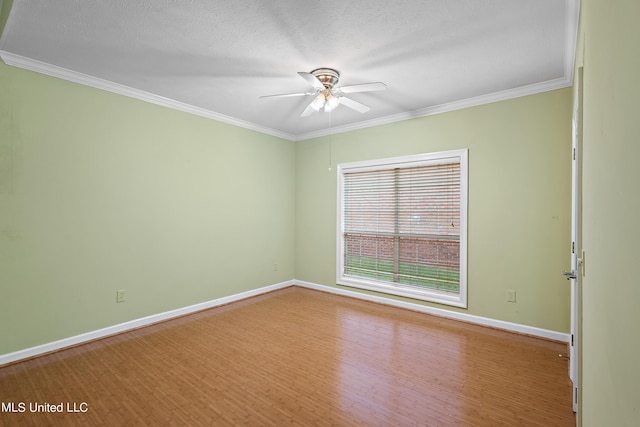 spare room featuring ornamental molding, a textured ceiling, wood-type flooring, and ceiling fan