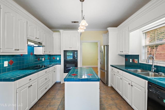 kitchen featuring a kitchen island, backsplash, sink, black appliances, and white cabinets