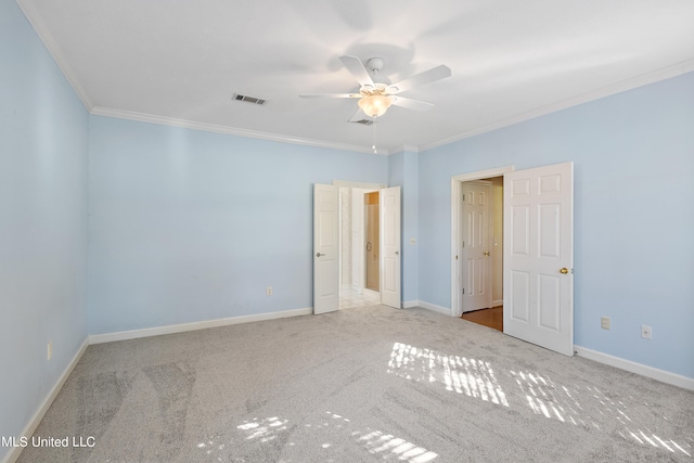 unfurnished bedroom featuring light carpet, crown molding, and ceiling fan