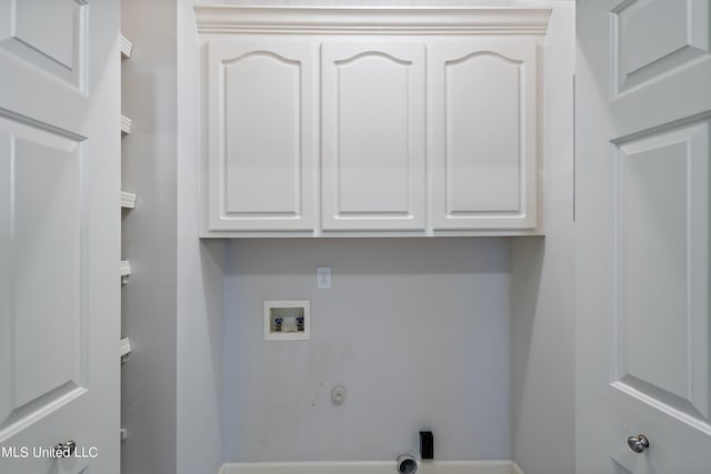 washroom featuring washer hookup, cabinets, and hookup for a gas dryer