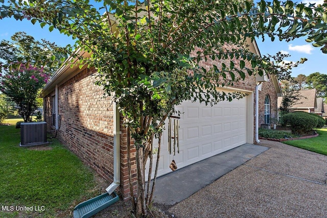 view of property exterior with central air condition unit and a yard