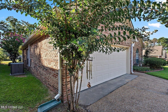 162 Apple Blossom Dr, Brandon, MS 39047 - view of property exterior featuring brick siding, central AC, driveway, and a yard