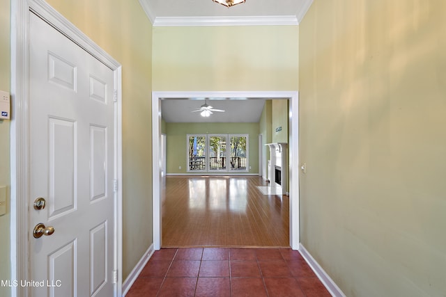 corridor with ornamental molding and dark hardwood / wood-style flooring