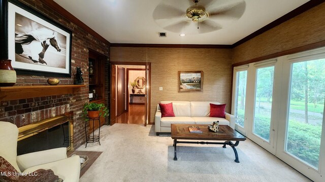 11 Aberdeen Rd, Natchez, MS 39120 - carpeted living area featuring plenty of natural light, ceiling fan, crown molding, and a brick fireplace