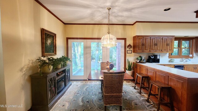 11 Aberdeen Rd, Natchez, MS 39120 - dining room with a chandelier, healthy amount of natural light, crown molding, and wood finished floors