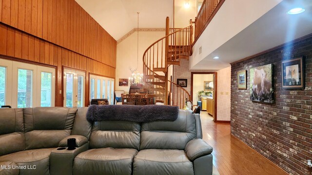 11 Aberdeen Rd, Natchez, MS 39120 - living area with a high ceiling, stairs, light wood-type flooring, and brick wall