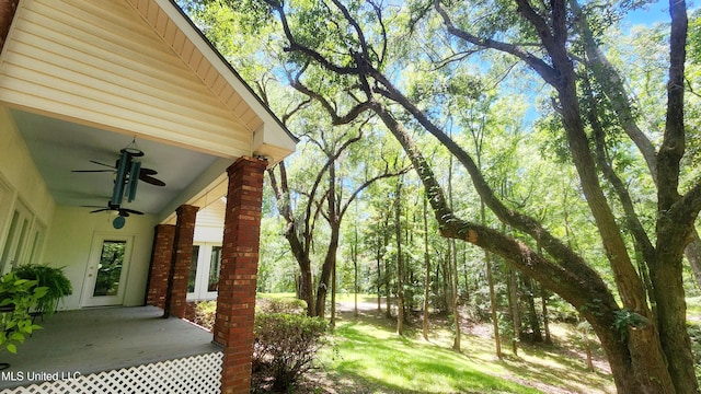 view of yard with ceiling fan