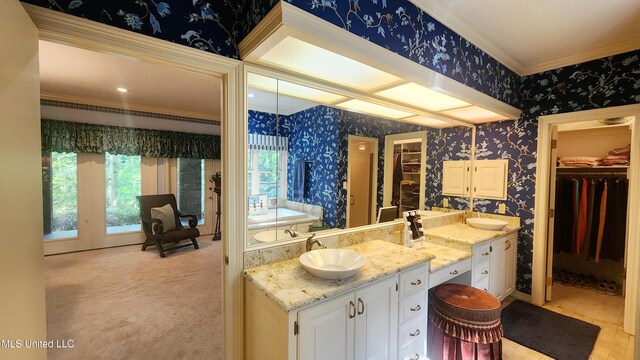 11 Aberdeen Rd, Natchez, MS 39120 - full bath featuring wallpapered walls, ornamental molding, double vanity, a spacious closet, and a garden tub