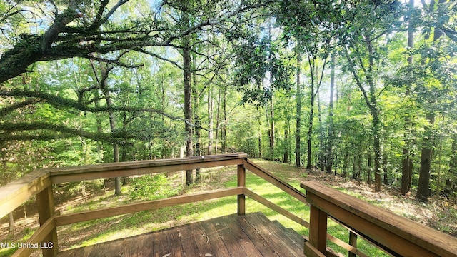 11 Aberdeen Rd, Natchez, MS 39120 - wooden terrace with a view of trees