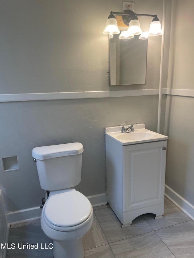 409 E Mayes St Unit 1, 2, 3, Jackson, MS 39206 - half bathroom with toilet, vanity, tile patterned flooring, and baseboards