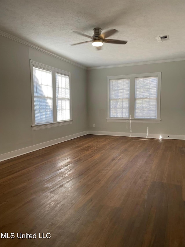 409 E Mayes St Unit 1, 2, 3, Jackson, MS 39206 - spare room featuring crown molding, ceiling fan, dark wood-type flooring, and healthy amount of natural light