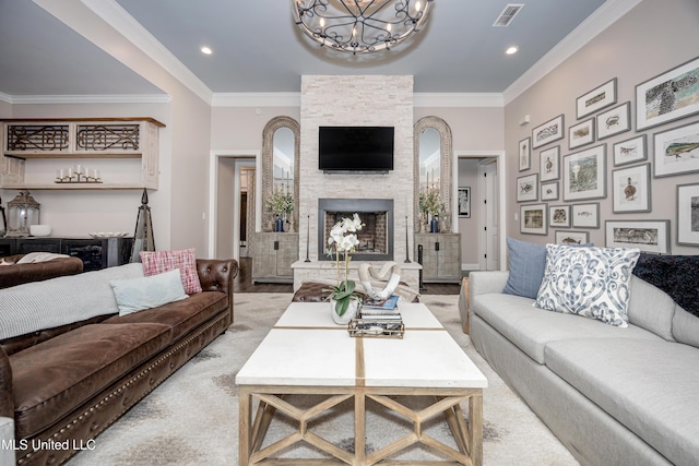 2011 Ivy Ct, Biloxi, MS 39532 - living area featuring a stone fireplace, ornamental molding, a chandelier, and visible vents