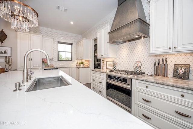 2011 Ivy Ct, Biloxi, MS 39532 - kitchen featuring ornamental molding, custom exhaust hood, visible vents, a sink, and appliances with stainless steel finishes