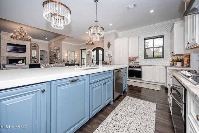 2011 Ivy Ct, Biloxi, MS 39532 - kitchen featuring stainless steel appliances, a chandelier, open floor plan, and a sink