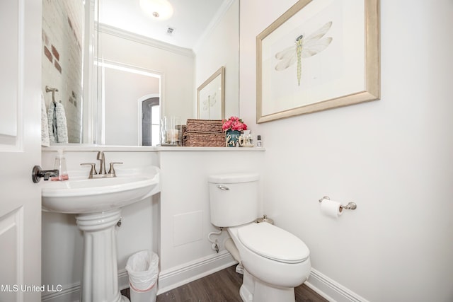 2011 Ivy Ct, Biloxi, MS 39532 - half bath featuring toilet, visible vents, crown molding, and wood finished floors