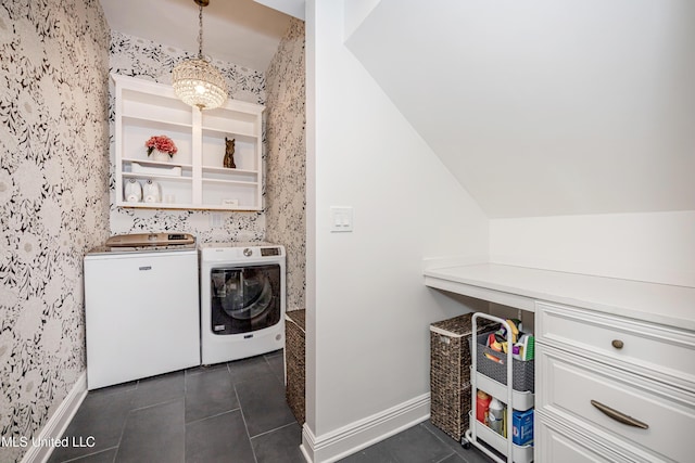2011 Ivy Ct, Biloxi, MS 39532 - washroom with washer and clothes dryer, laundry area, dark tile patterned flooring, baseboards, and wallpapered walls